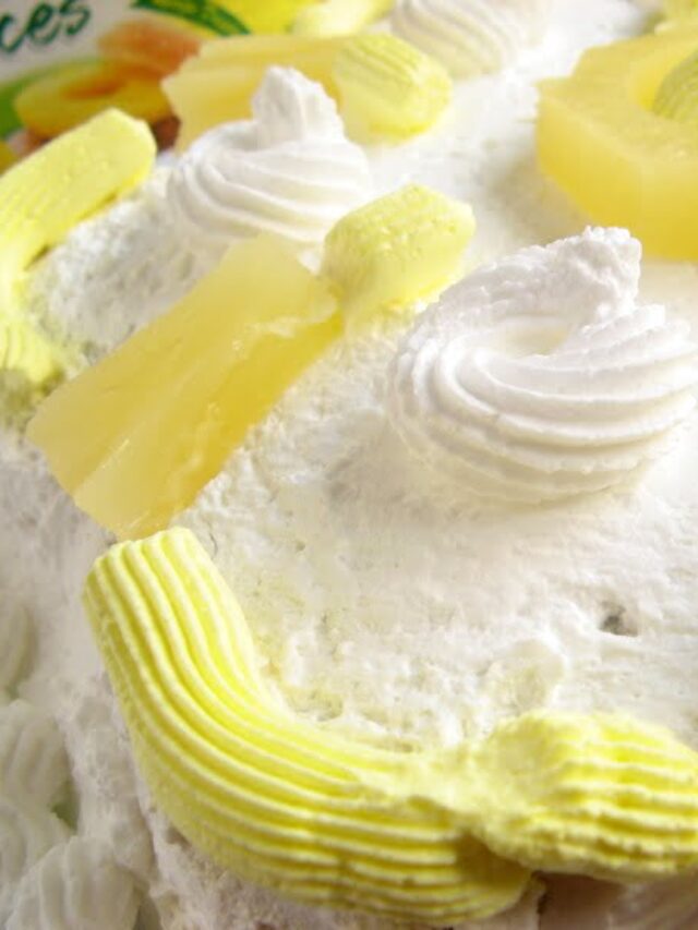 A whole eggless pineapple gateau with layers of pineapple filling and whipped cream