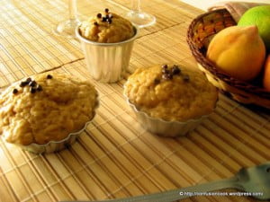 Close-up view of eggless banana peach muffins with a golden-brown crust