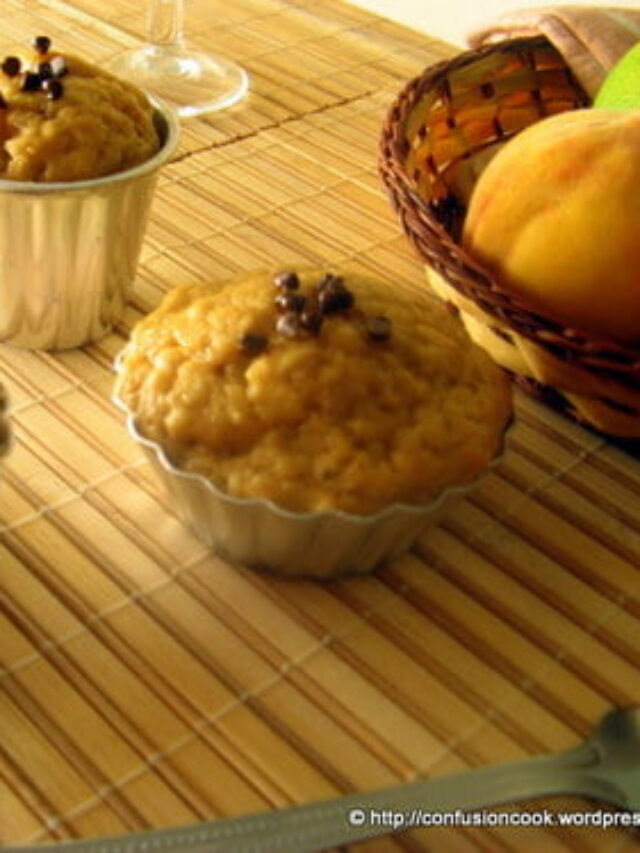 Close-up view of eggless banana peach muffins with a golden-brown crust