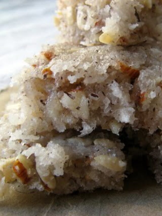 A bowl of Panjiri, filled with a mix of nuts, seeds, and roasted wheat flour, garnished with dried fruits