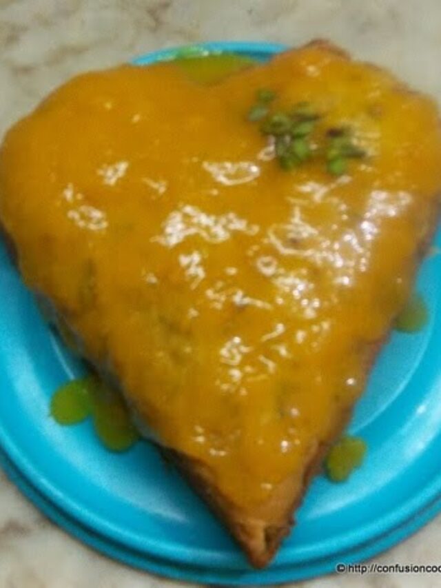 Eggless mango cake topped with mango sauce