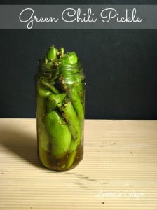 Jar of Bharwa Hari Mirch ka Achar with stuffed green chilies and spices