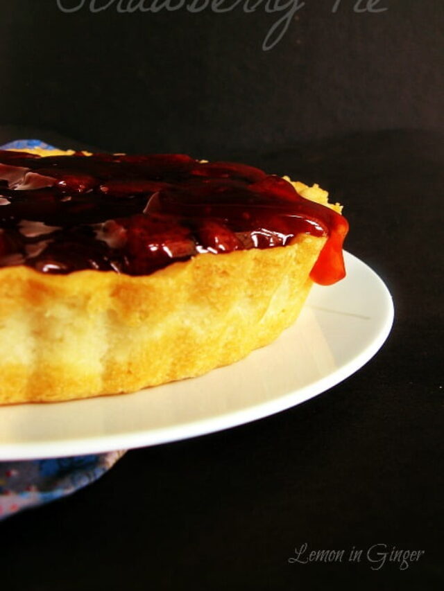 Strawberry pie topped with fresh strawberry sauce