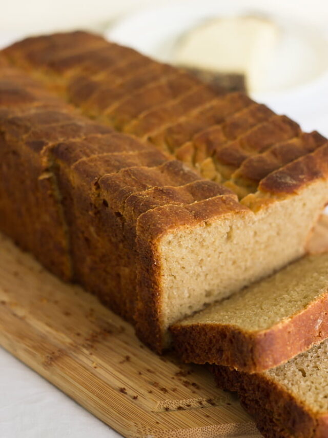 Close-up view of slices of whole wheat bread loaf kept on a tray