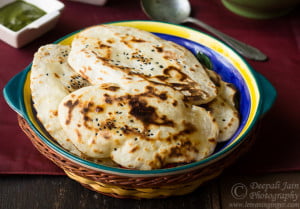 Soft homemade naan without yeast on a wooden board