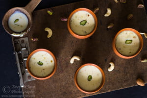 Close-up of a glass of Kadha Doodh (Masala Milk) with a rich, creamy texture