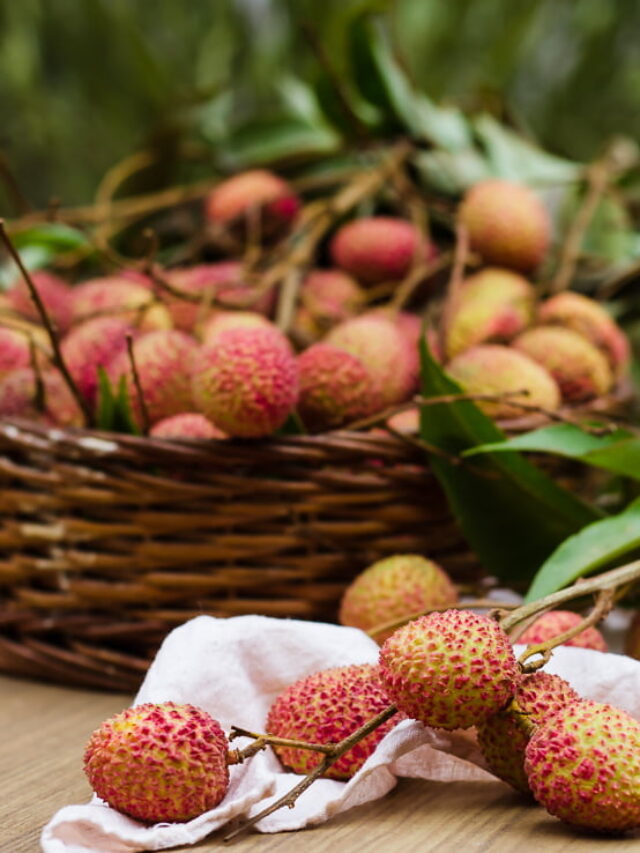 A basket filled with fresh, succulent lychees