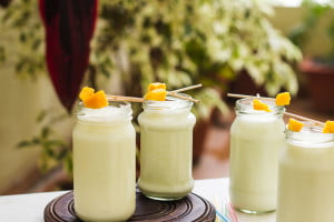 Sweet lassi served in glasses showcasing smooth, creamy consistency