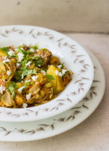 Non-veg style kathal ki sabji topped with grated cheese