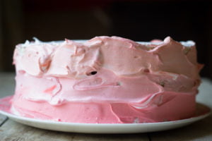 Beautifully decorated Eggless Strawberry Ombre Cake ready to be served