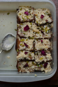 A plate of Authentic Shahi Tukda garnished with chopped pistachios and almonds