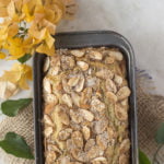 Close-up of a moist and fluffy eggless cardamom cinnamon cake topped with sugar