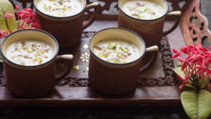 A beautifully presented bowl of Gur ki Kheer topped with chopped nuts