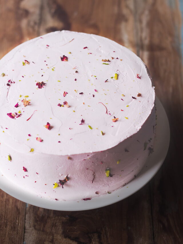 Moist and fluffy rose cake topped with pistachios