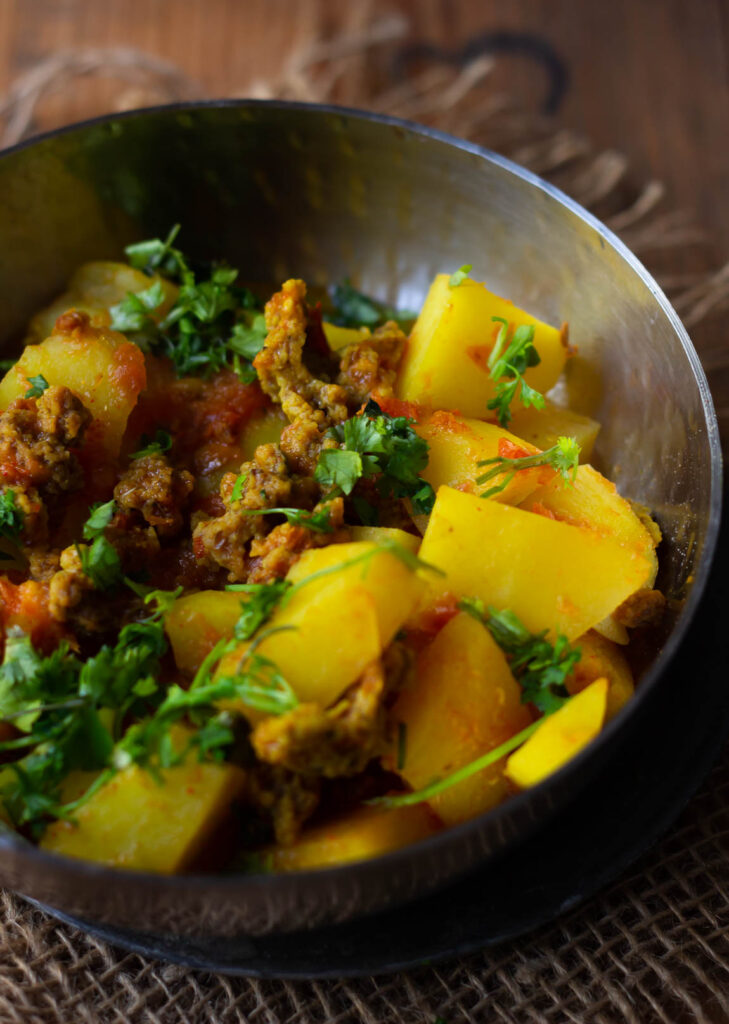 Aloo Punjabi Wadi ki Subzi in a bowl - Traditional North Indian Curry Recipe