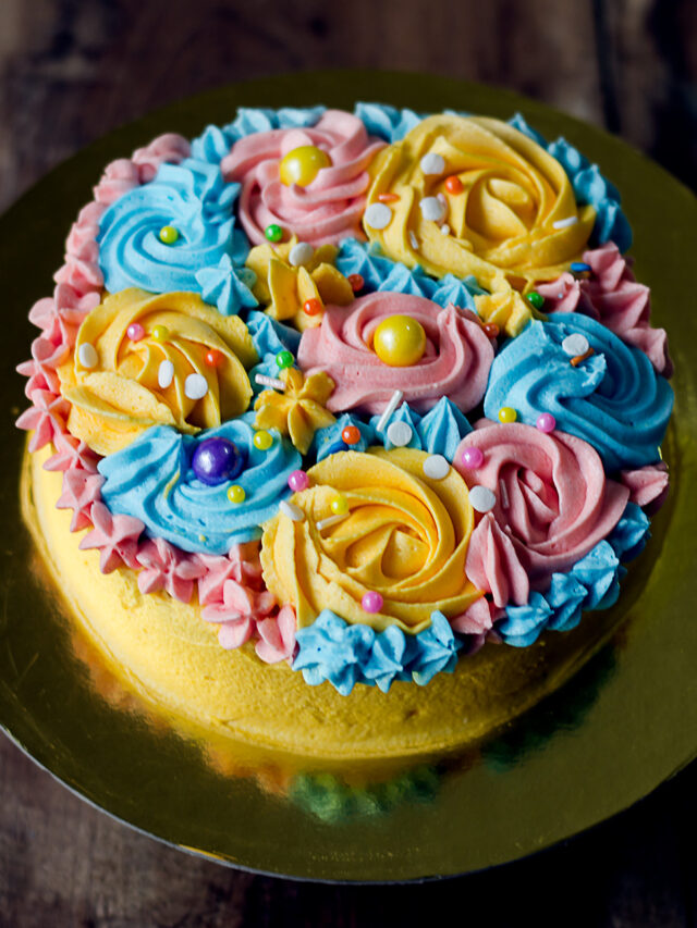 A top view of the fully decorated eggless buttercream garden cake, showcasing the detailed floral artwork