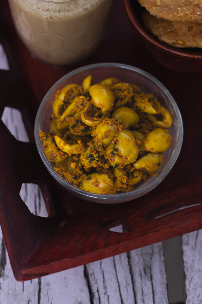 Close-up of Karoda Pickle showing the juicy, spiced karondas