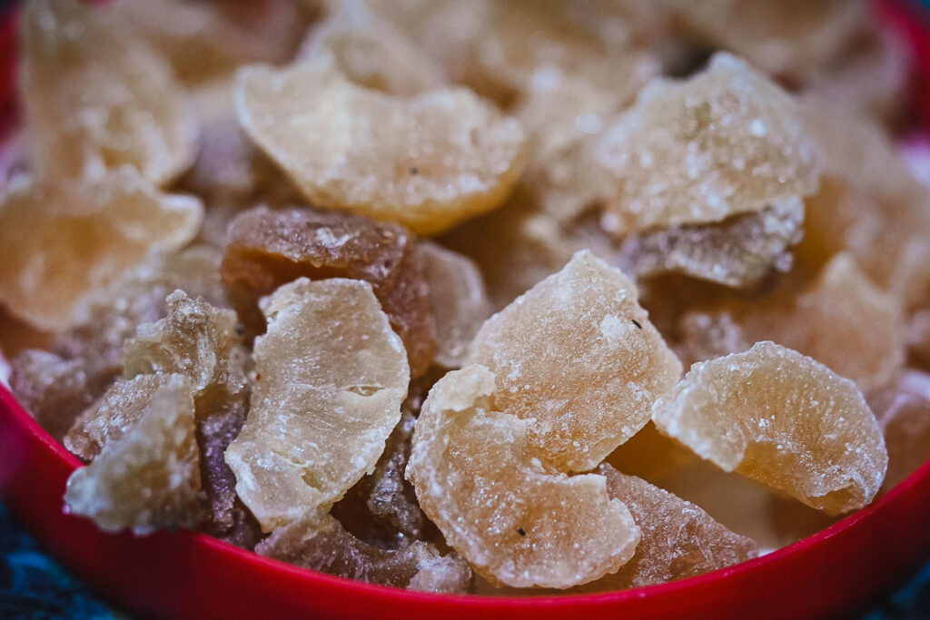 Fully dried amla candy with a sugary coating ready to eat.