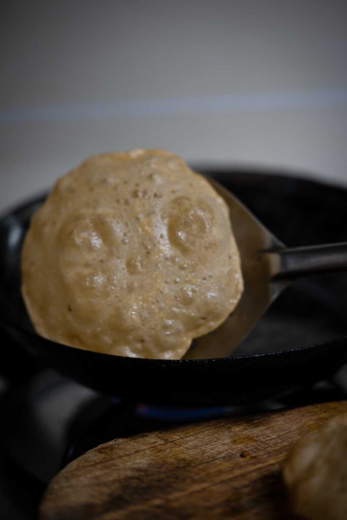 Soft poori texture close-up after frying